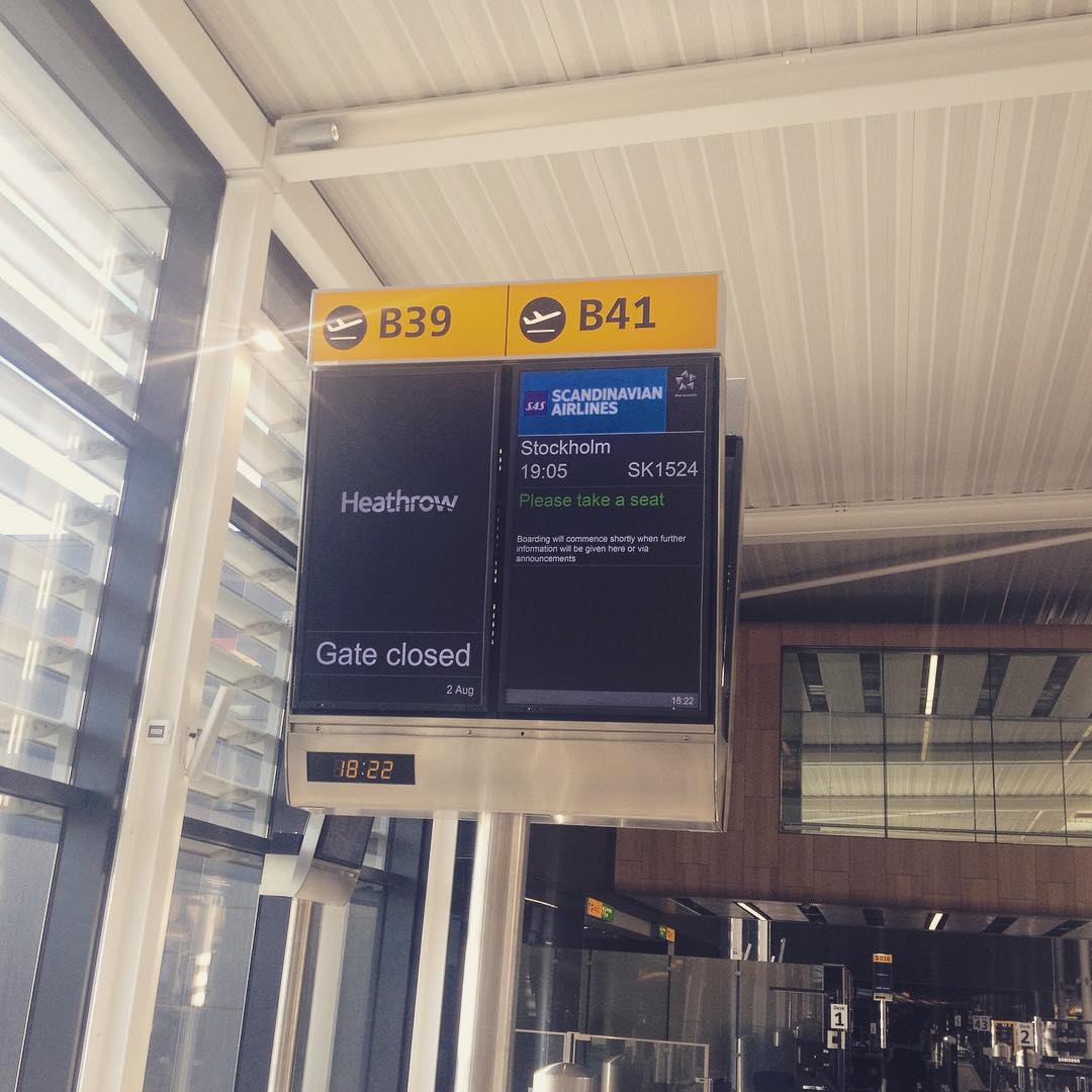Airport departure gate sign showing B39 "Gate closed" and B41 SAS Airlines flight to Stockholm, 19:05, SK1524.