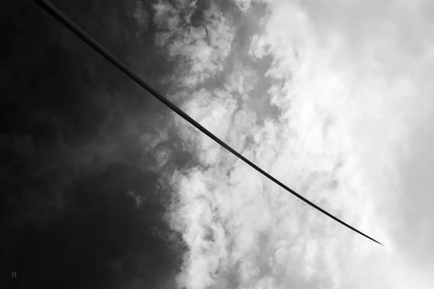 Black and white photograph exploring contrast between darkness and light