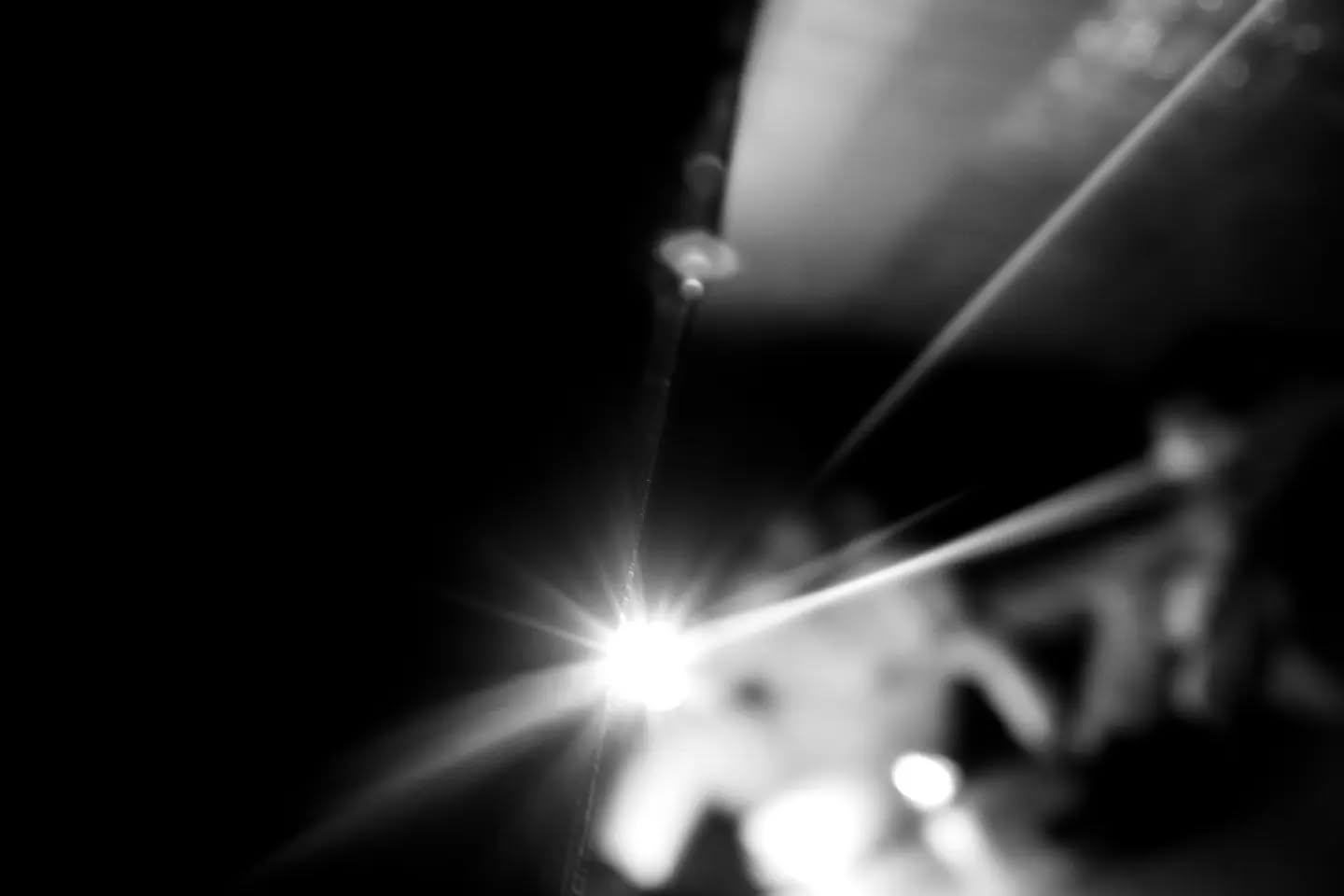 Black-and-white photograph with a dreamy, star-like quality, evoking a sense of wonder