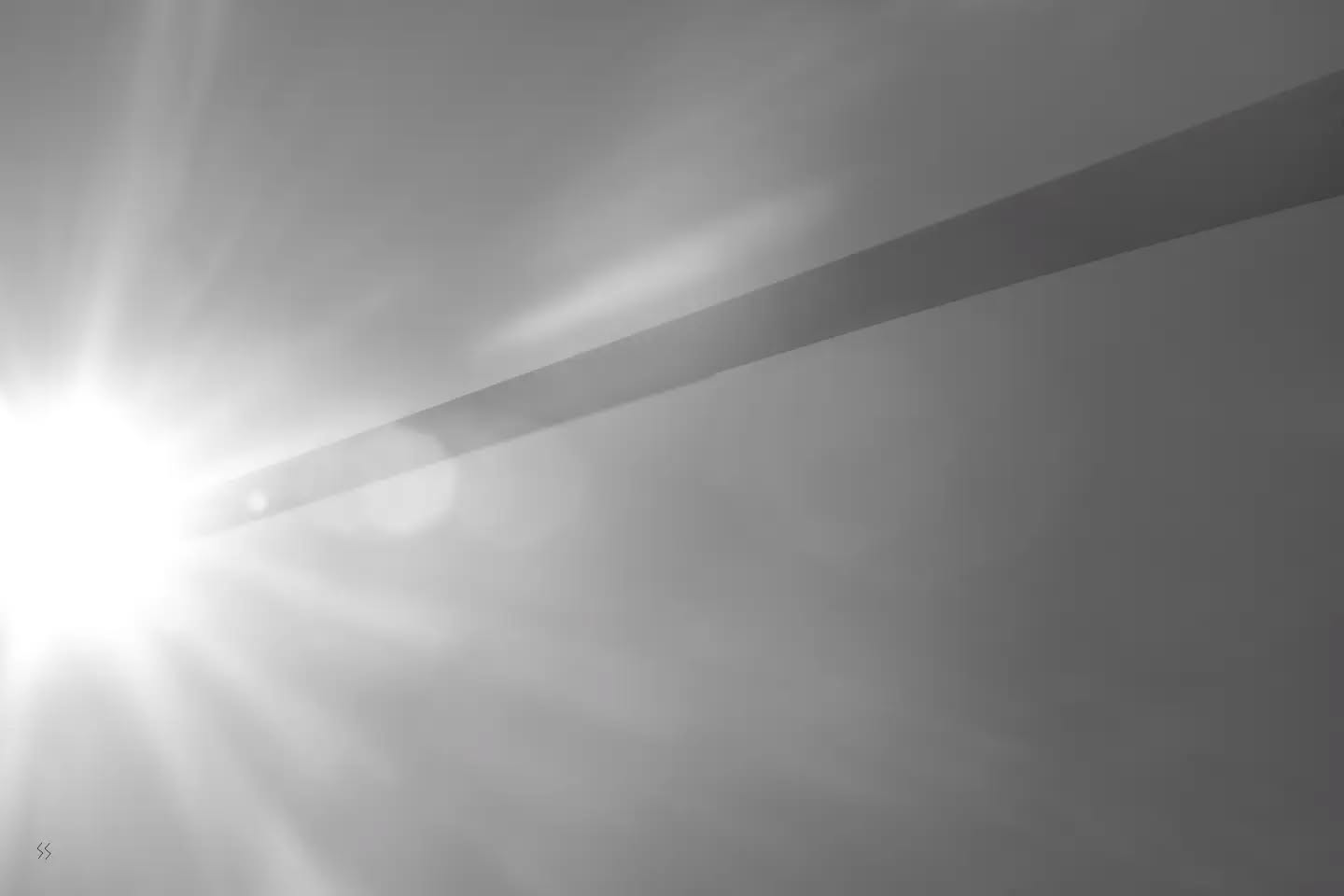 Black and white photograph evoking fire and sparks, with a dramatic, sublime mood.
