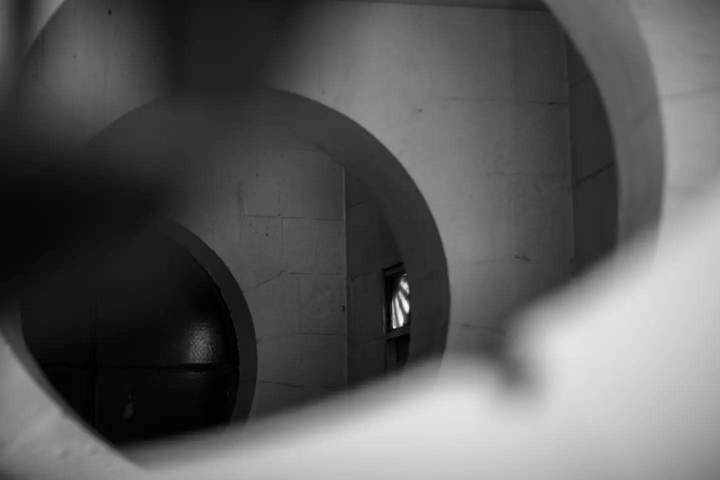 Black and white photograph with an abstract, symbolic composition evoking a contemplative, otherworldly mood.